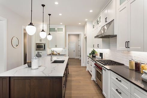 A designed kitchen with wooden floor, freshly painted